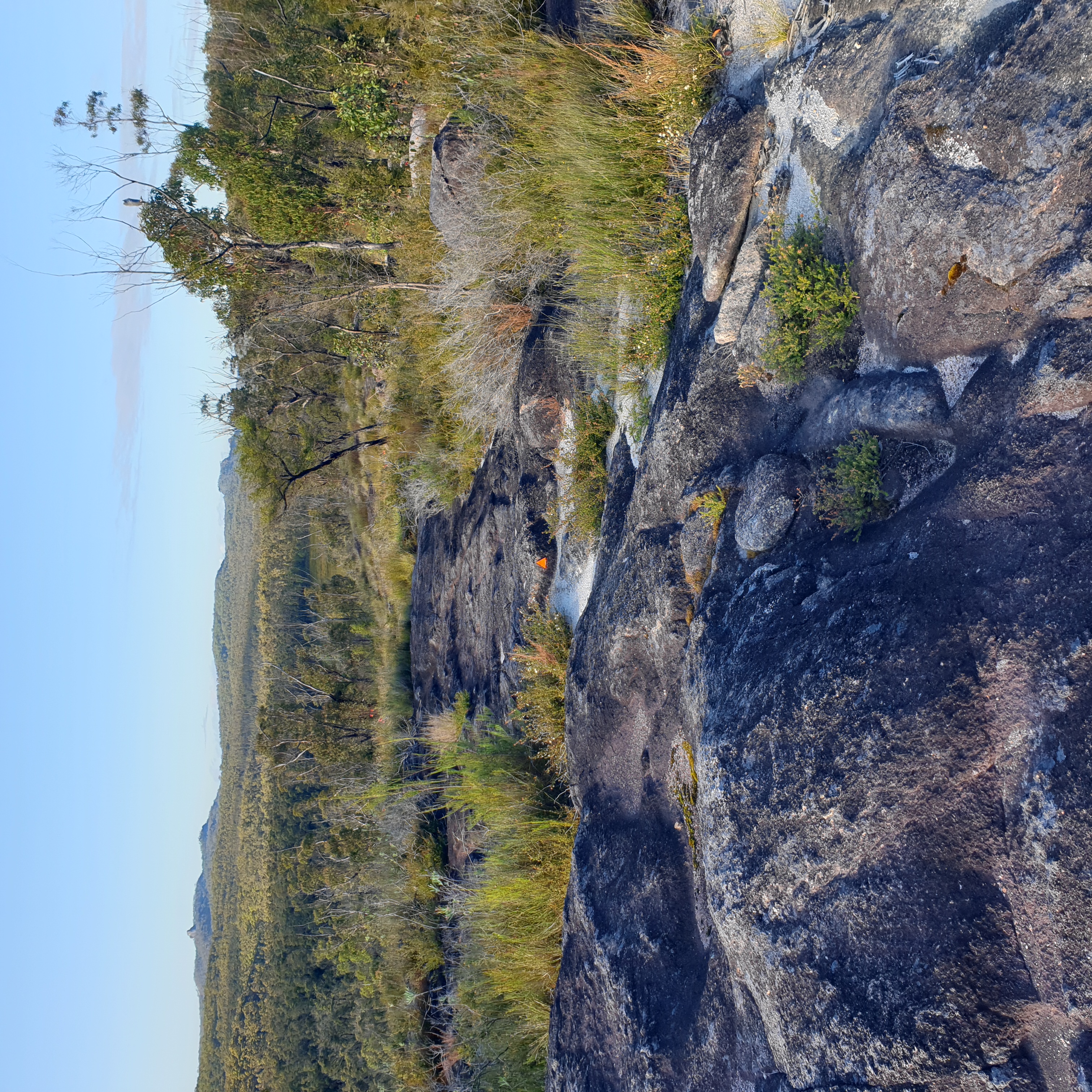 On a nice night, a high bivy camp among the rocks with Old Man Hat on left Avil Rock and Dandahra Crags on right in the distance